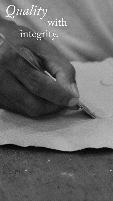 Artisan hand-finishing leather at behno New York workshop
