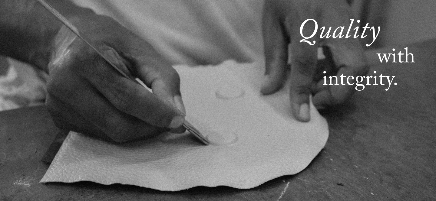 Artisan hand-finishing leather at behno New York workshop